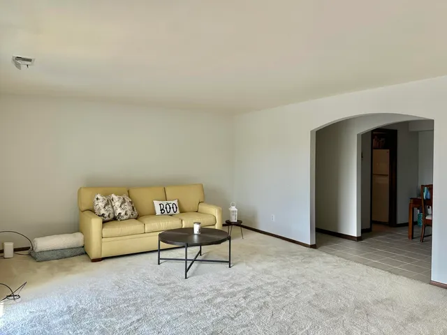a living room with furniture and a couch