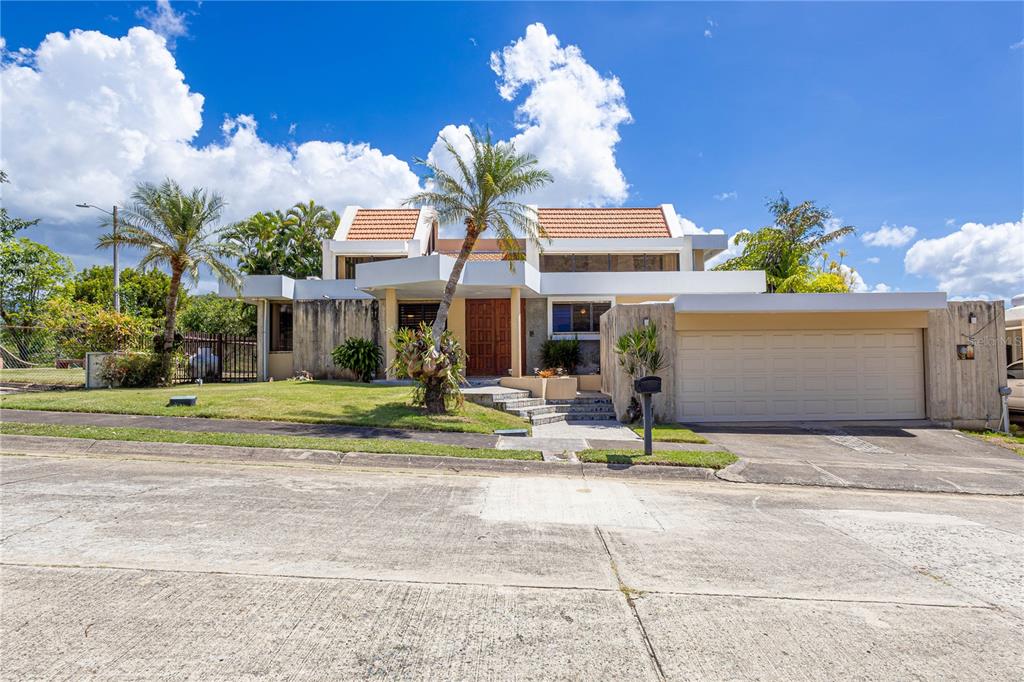 28 Francisco Oller Extension Ponce, Ponce 00730 - Photo 1 of 1 a view of a house with a yard and sitting area