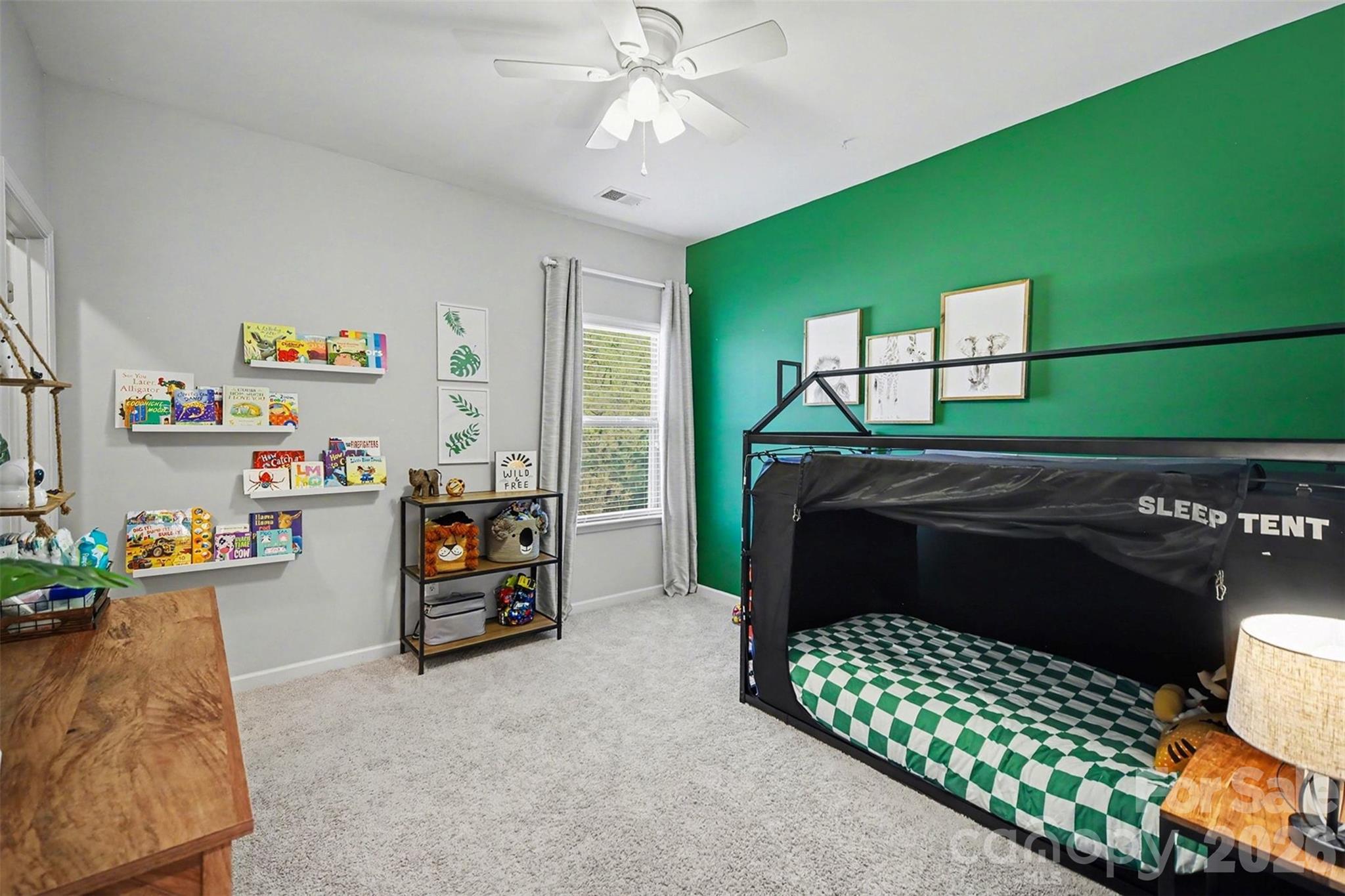 514 Tack Lane Midland, NC 28107 - Photo 30 of 48 a bedroom with a bed and a chandelier