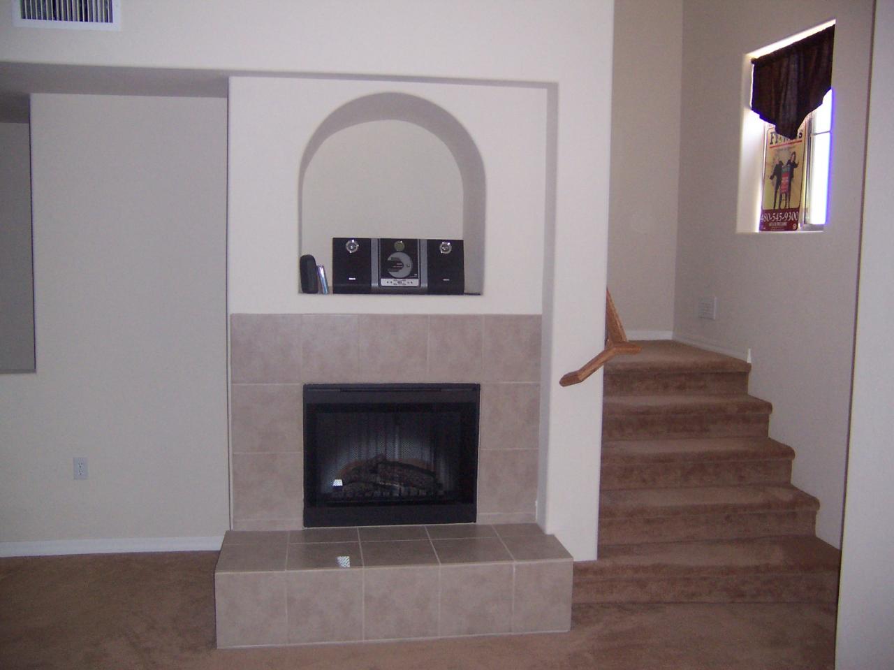 3935 East Rough Rider Road, Unit 1072 Phoenix, AZ 85050 - Photo 3 of 8 family room fireplace