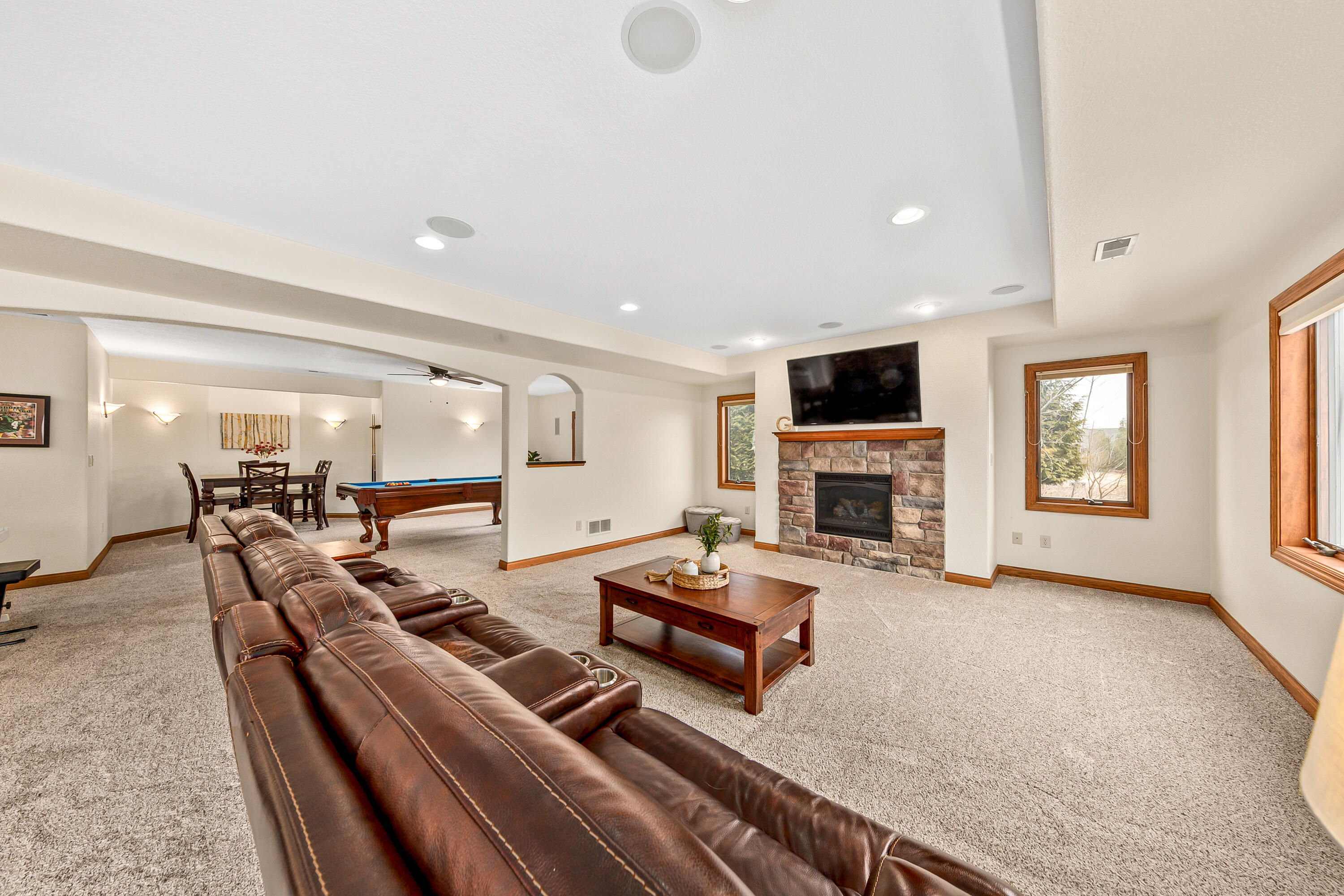 S62W28195 Ridge Valley Road Genesee, WI 53189 - Photo 44 of 68 Gas fireplace, TV (included) and surround sound.