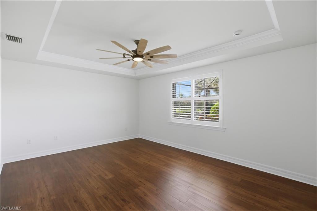 11041 Castlereagh Street Fort Myers, FL 33913 - Photo 11 of 49 wooden floor in an empty room with a window