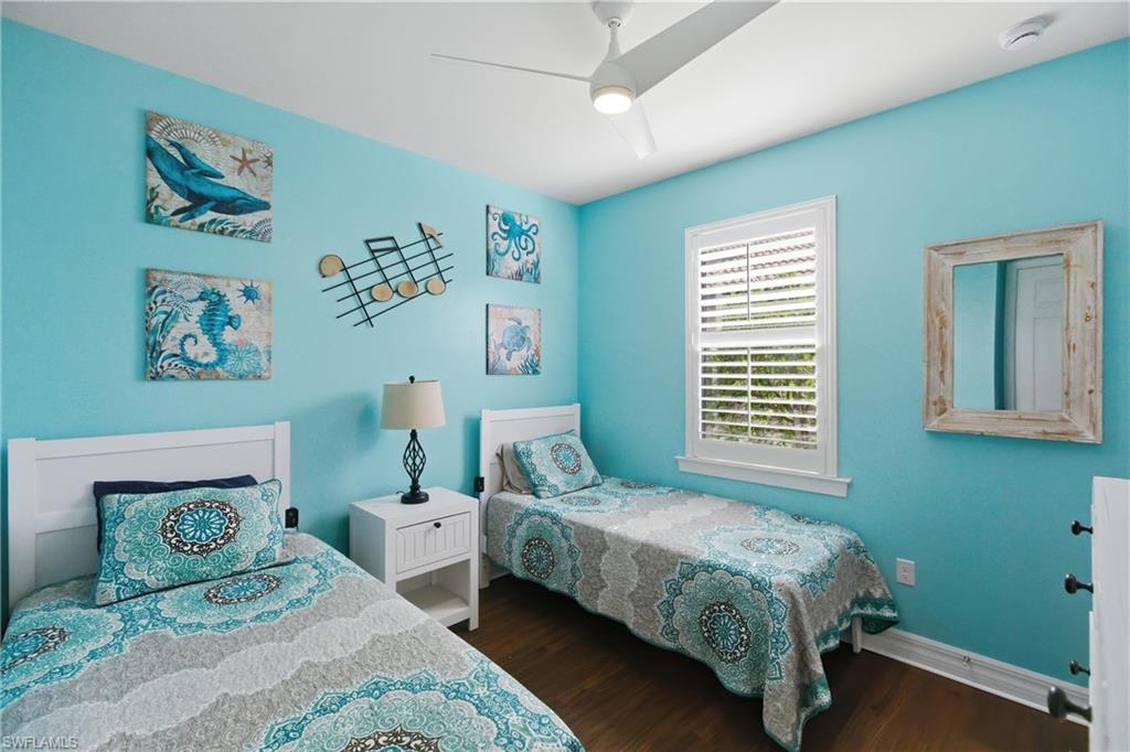 11041 Castlereagh Street Fort Myers, FL 33913 - Photo 20 of 49 a bedroom with a bed a wall painting and a window
