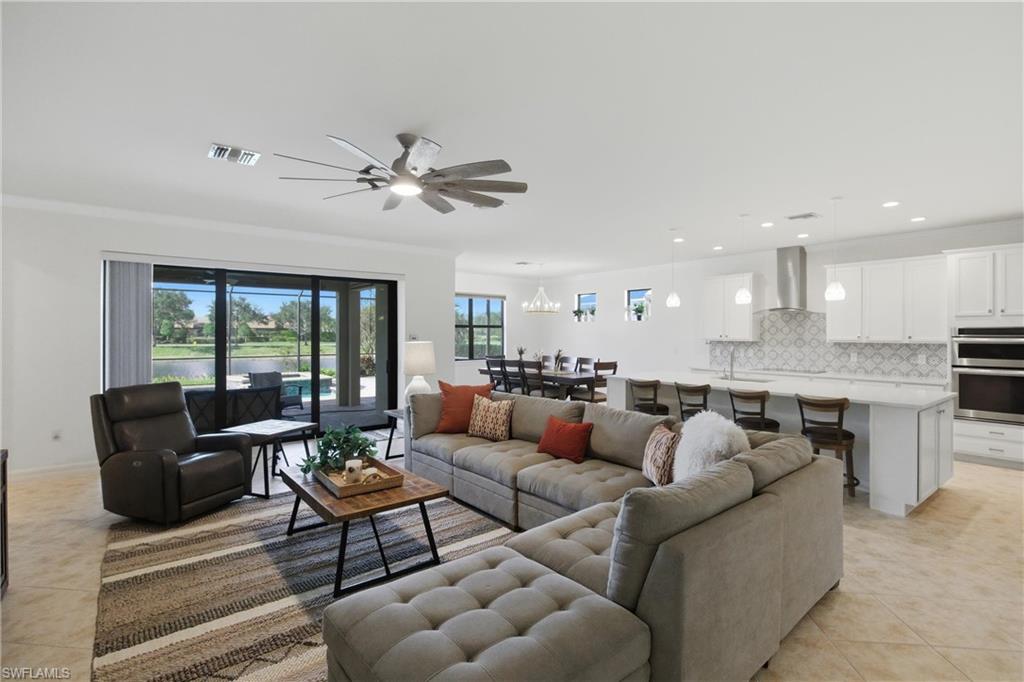 11041 Castlereagh Street Fort Myers, FL 33913 - Photo 2 of 49 a living room with furniture and a large window