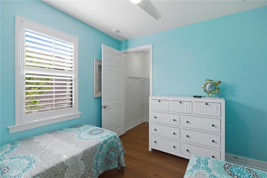 11041 Castlereagh Street Fort Myers, FL 33913 - Photo 21 of 49 a bedroom with a bed and a dresser