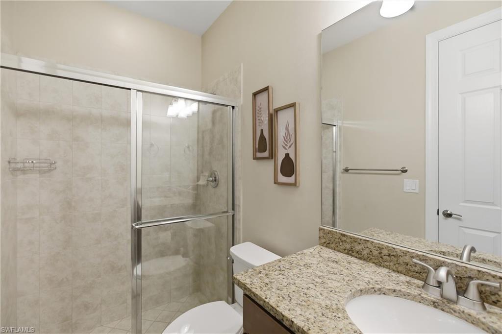 11041 Castlereagh Street Fort Myers, FL 33913 - Photo 23 of 49 a bathroom with a granite countertop shower sink vanity and toilet