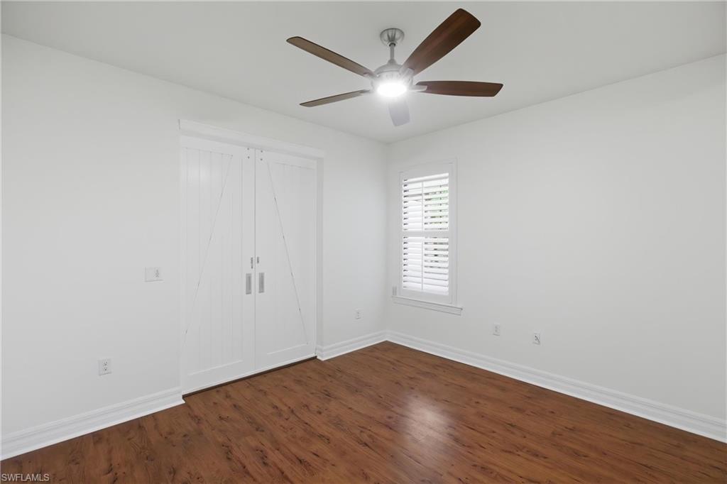 11041 Castlereagh Street Fort Myers, FL 33913 - Photo 25 of 49 an empty room with wooden floor and windows