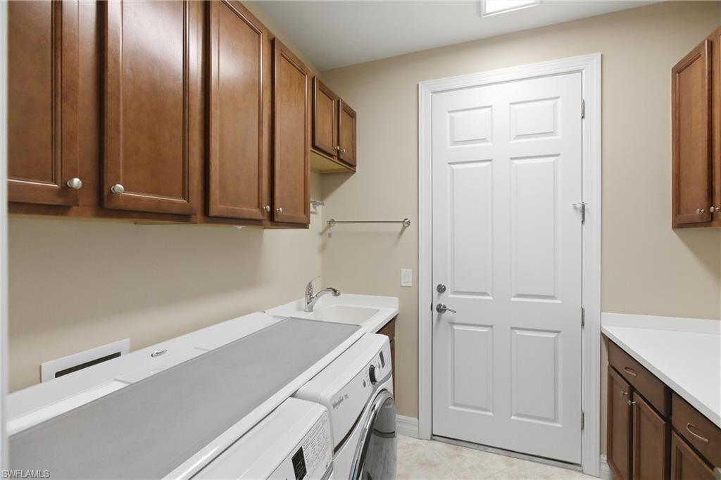 11041 Castlereagh Street Fort Myers, FL 33913 - Photo 32 of 49 a room with a sink and cabinets