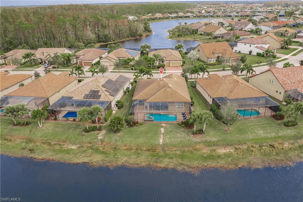 11041 Castlereagh Street Fort Myers, FL 33913 - Photo 35 of 49 an aerial view of residential houses with outdoor space and parking