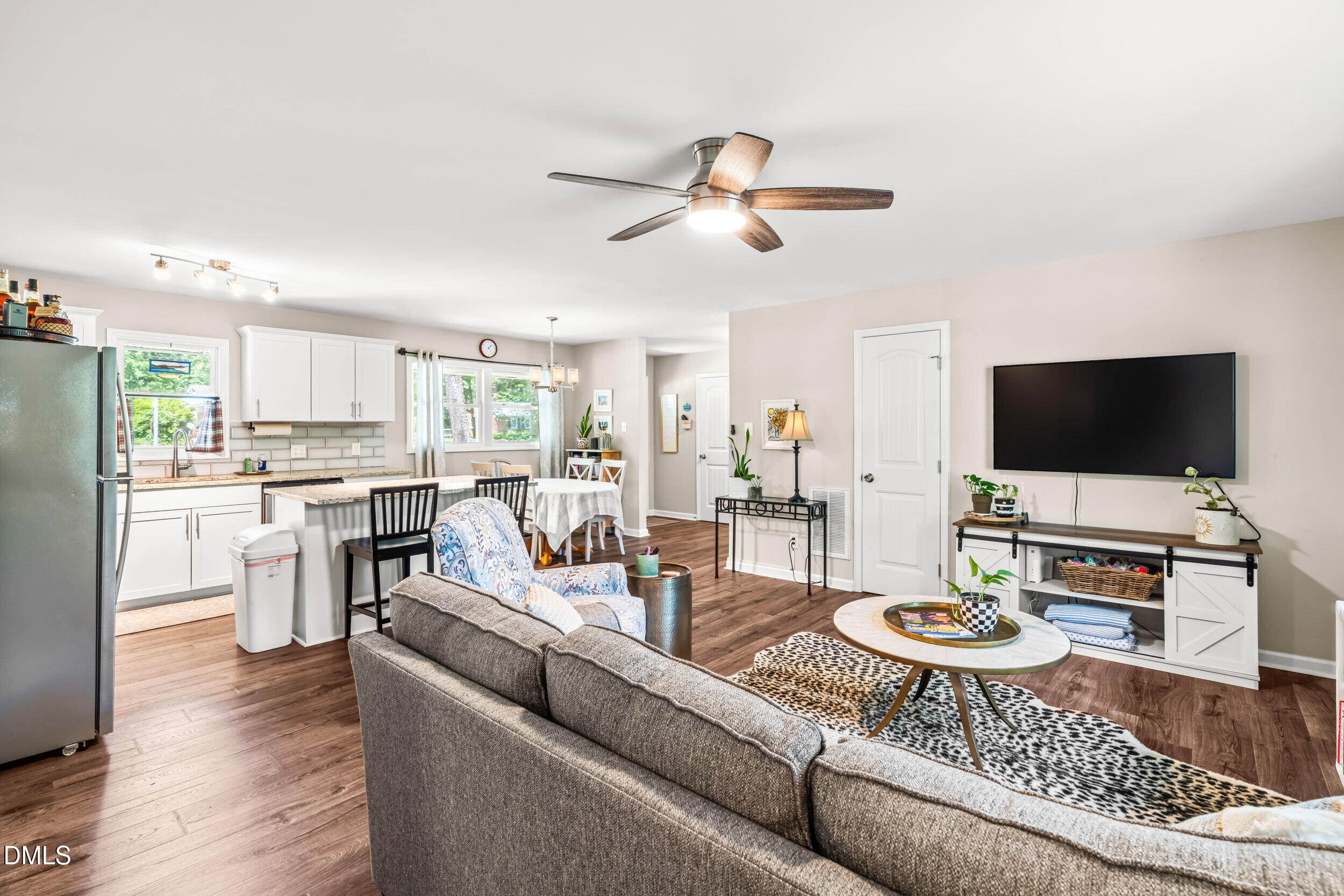 3724 Randell Road Garner, NC 27529 - Photo 13 of 32 a living room with furniture and a flat screen tv