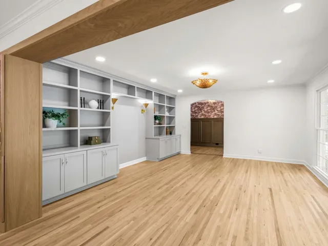a kitchen with kitchen island granite countertop a sink and a stove