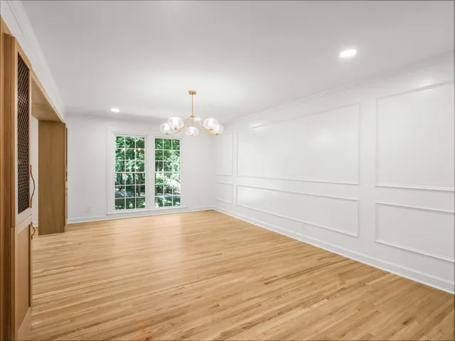 a kitchen with a large window cabinets and stainless steel appliances