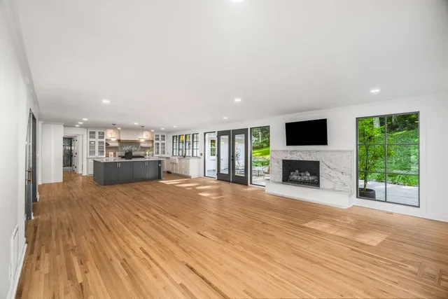 a bathroom with a sink a mirror and a shower curtain