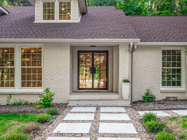 a front view of a house having yard