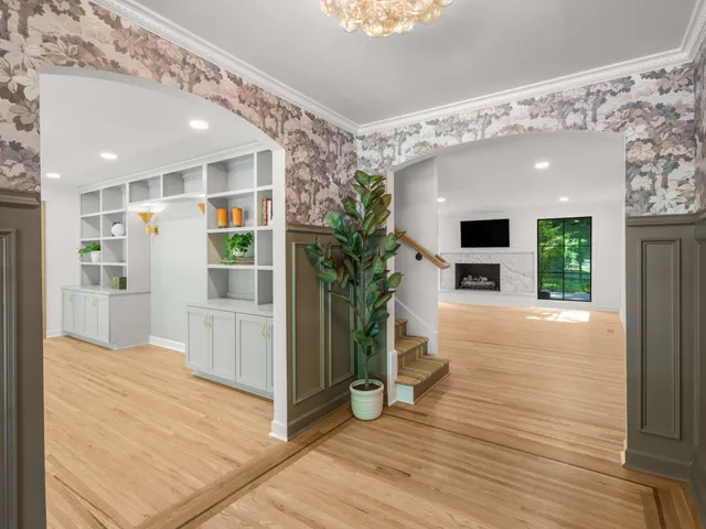 a view of a kitchen with a sink and a large window