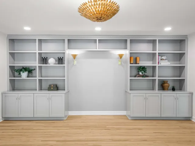 a kitchen with kitchen island granite countertop lots of counter top space and wooden floor