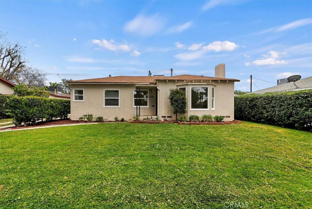 6158 Del Ray Court Riverside, CA 92506 - Photo 1 of 1 a view of a backyard with plants and a garden