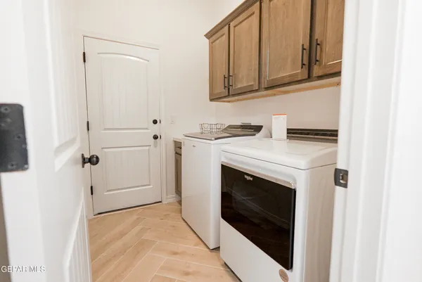 a view of a kitchen with washer and dryer