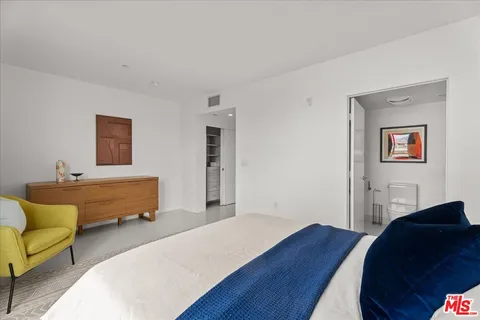 a bedroom with furniture and a couch