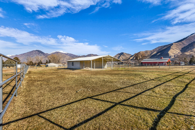 1060 West 2620th Street South Mapleton, UT 84664 - Photo 66 of 87 View of yard featuring a mountain view and an outdoor structure