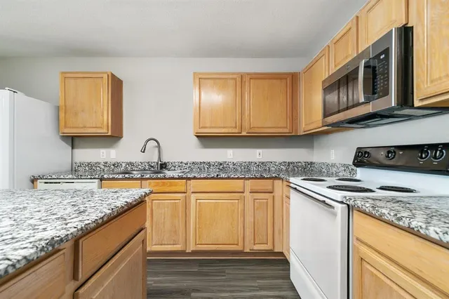 a kitchen with a stove and a microwave