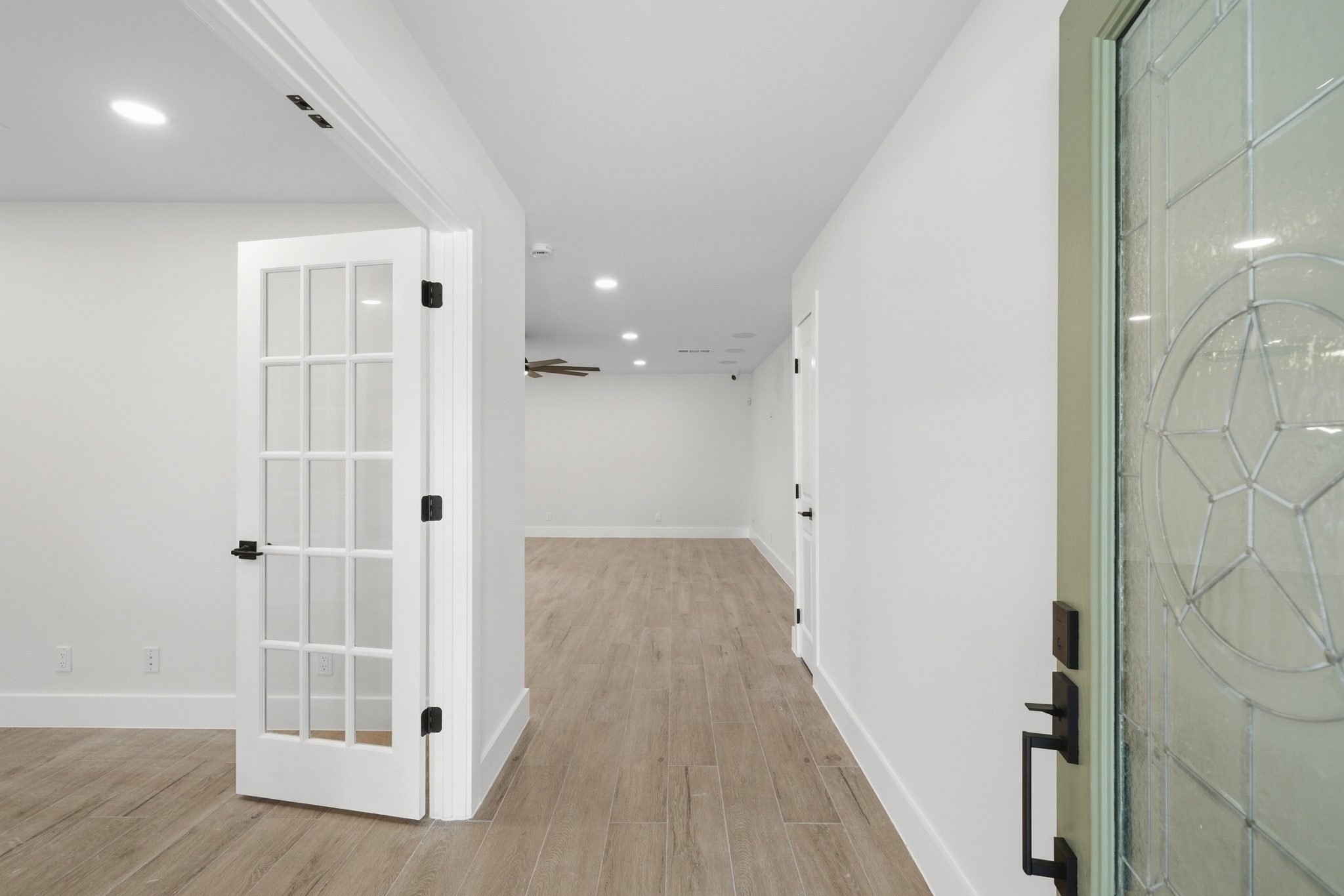 18918 Casper Drive Spring, TX 77373 - Photo 5 of 32 Step inside to discover an impressive full renovation featuring new wood look tile flooring, fresh paint, and updated lighting throughout the home.