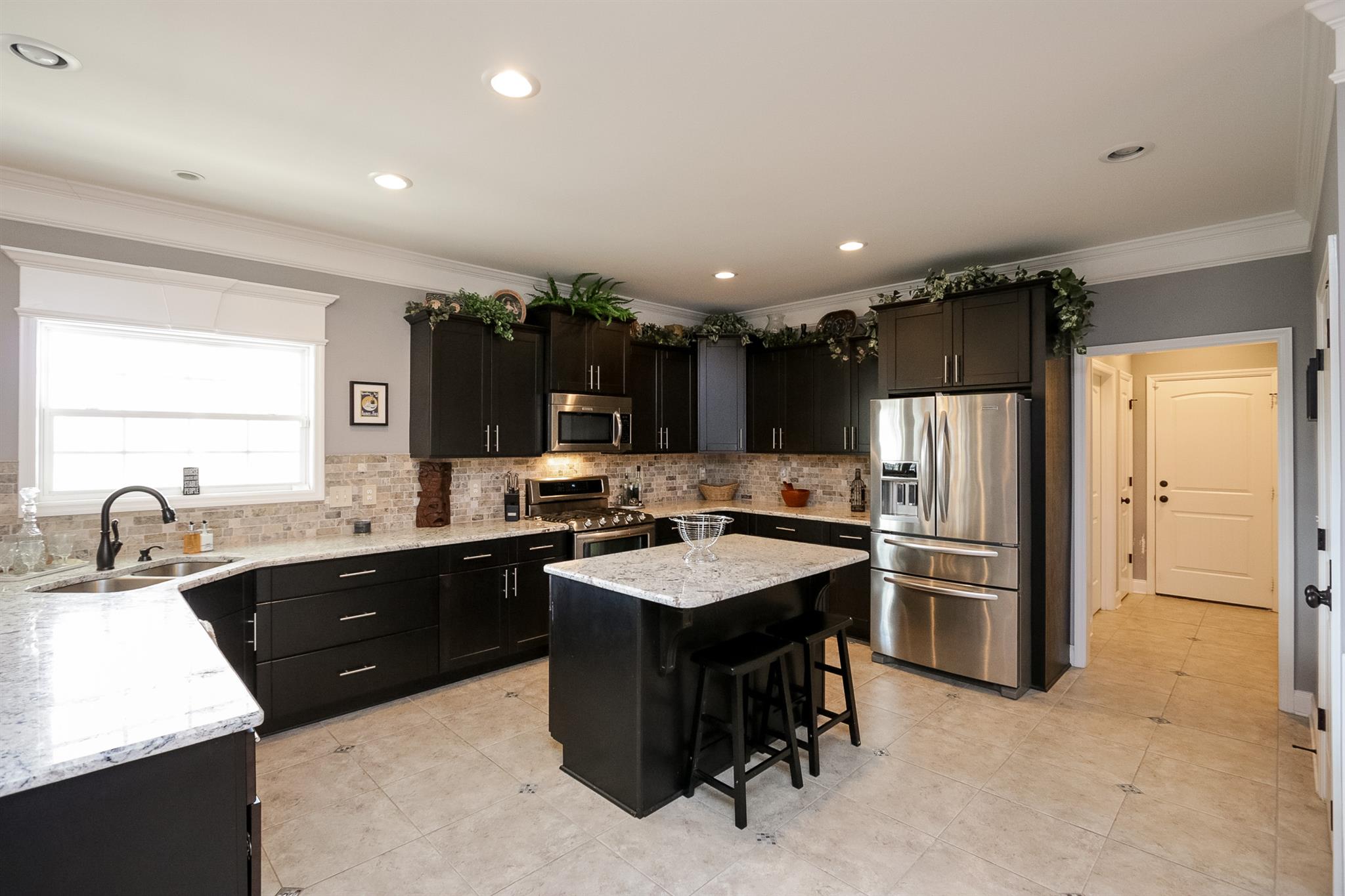 1069 Northern Road Mount Juliet, TN 37122 - Photo 6 of 30 a kitchen with kitchen island a sink stove and refrigerator