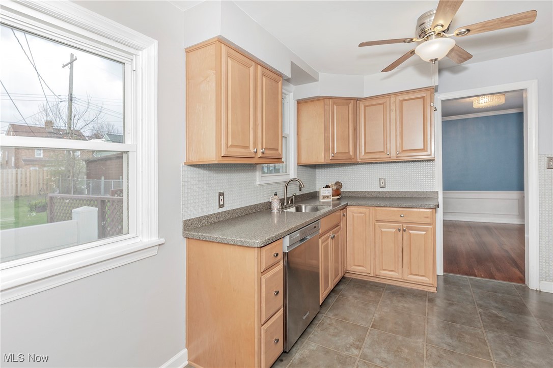 3826 Silsby Road Cleveland, OH 44118 - Photo 10 of 41 Kitchen with backsplash, a ceiling fan, dishwasher, a sink, and light brown cabinetry