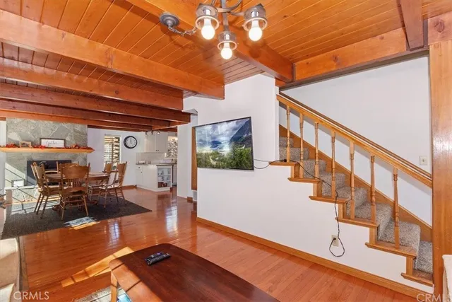 a view of a living room with wooden floor