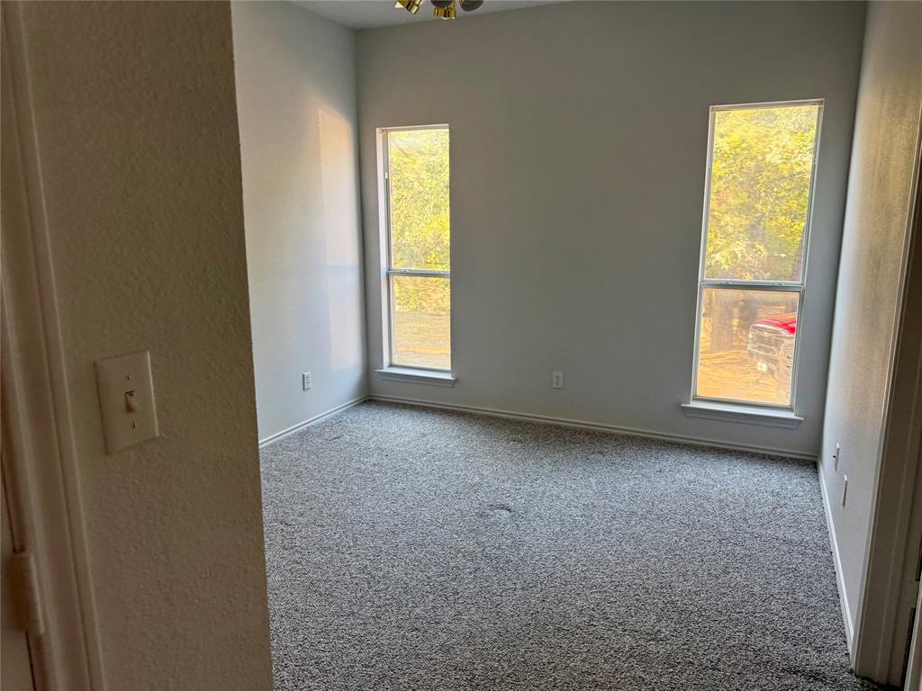 2116 Clear Lake Road Weatherford, TX 76087 - Photo 12 of 21 a view of an empty room with a window