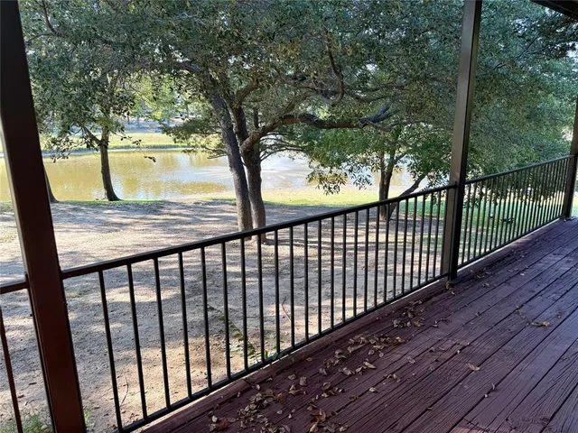a view of balcony with wooden floor