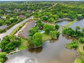 an aerial view of a city and lake view