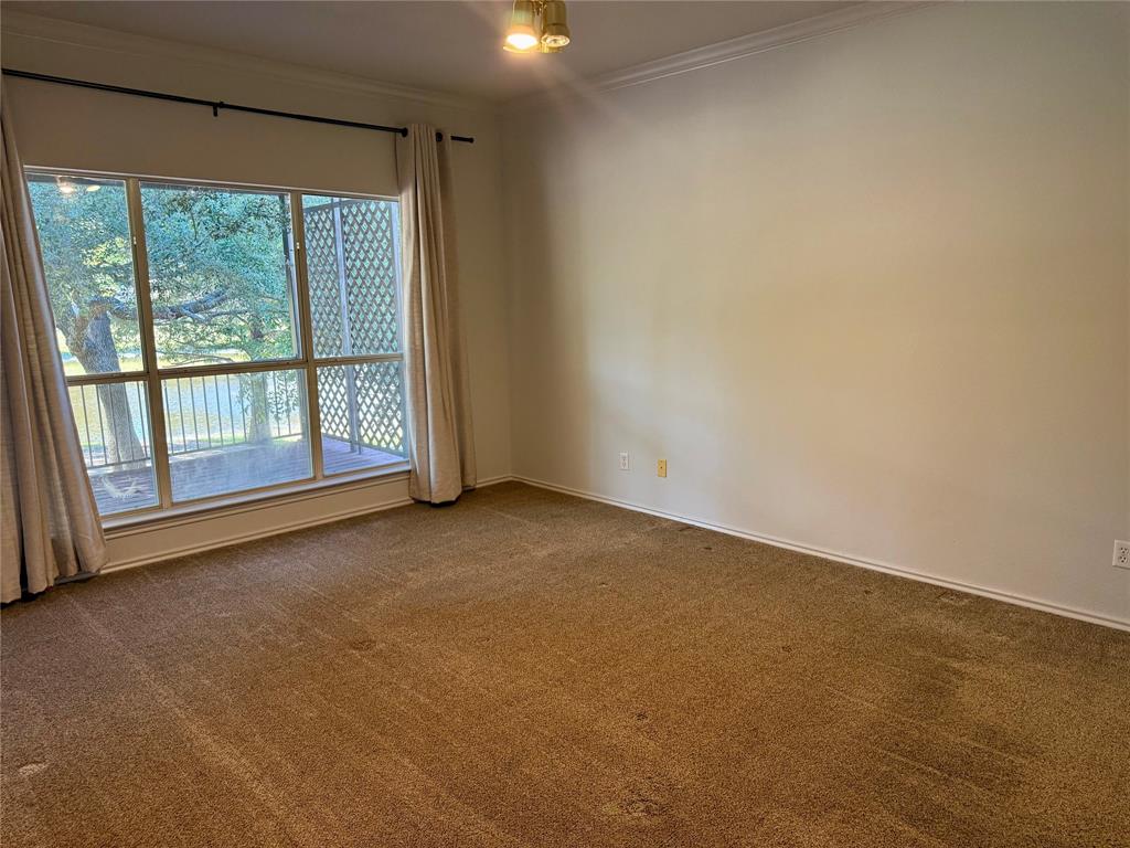 2116 Clear Lake Road Weatherford, TX 76087 - Photo 9 of 21 a view of an empty room with a window