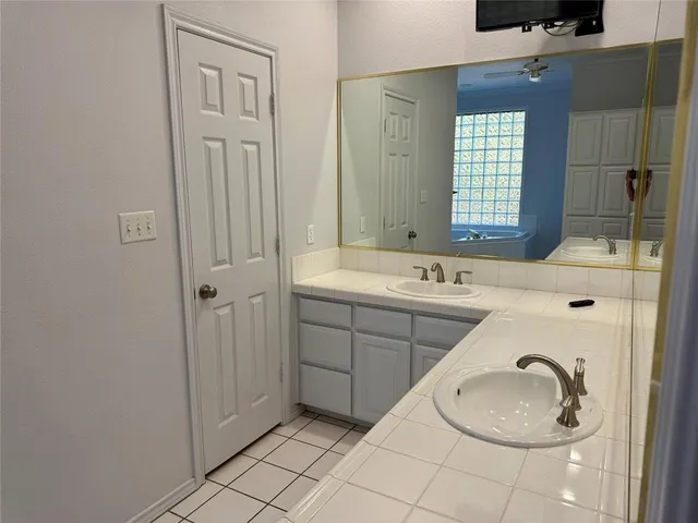 a bathroom with a sink and a mirror