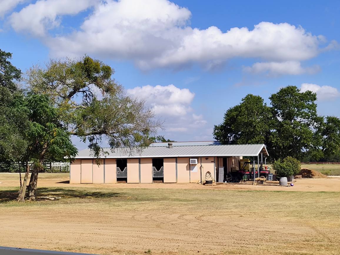 3550 County Road 245 Florence, TX 76527 - Photo 19 of 38 Barn currently designed with stalls, climate controlled tack room, feed room, and storage space. Covered wash area is nice and convenient.