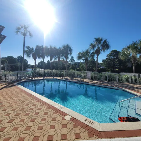 a view of a swimming pool with a patio
