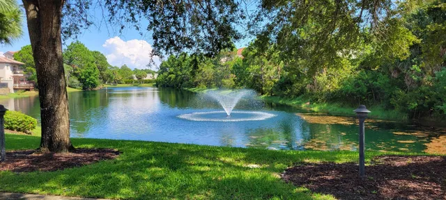 a view of a garden with a lake