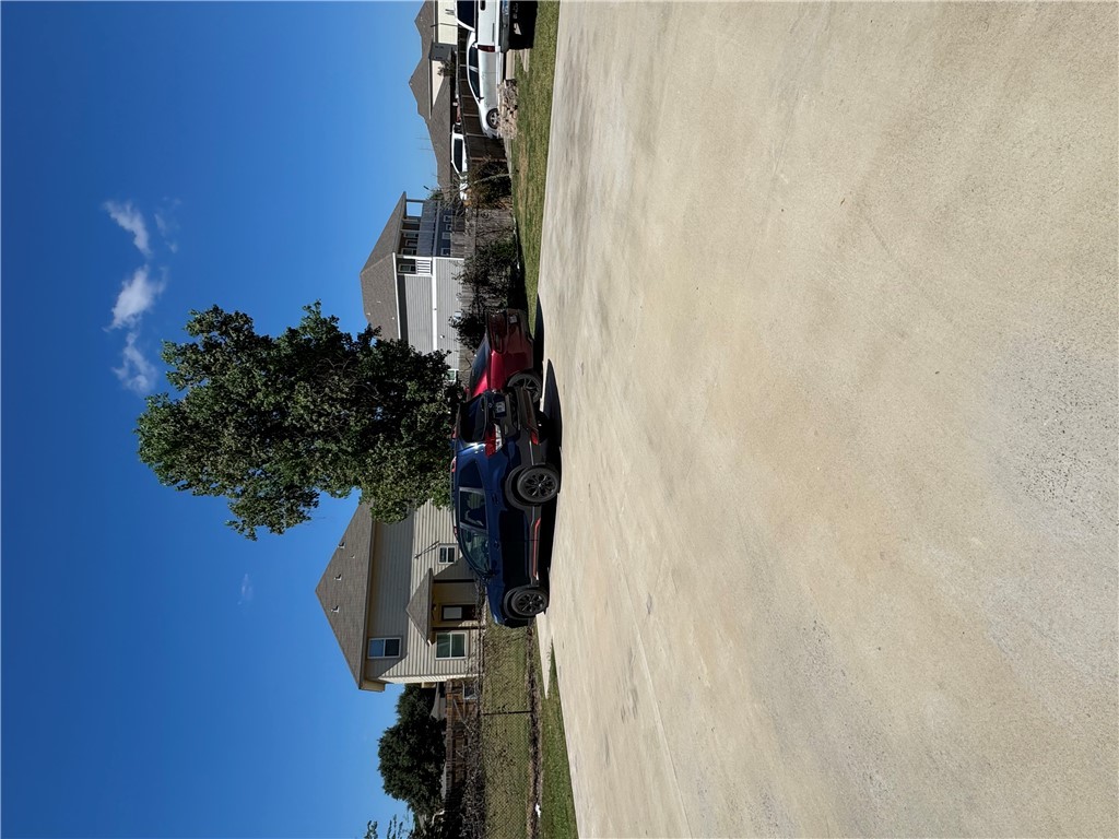 6991 Halter Loop College Station, TX 77845 - Photo 5 of 8 a front view of a house with cars parked