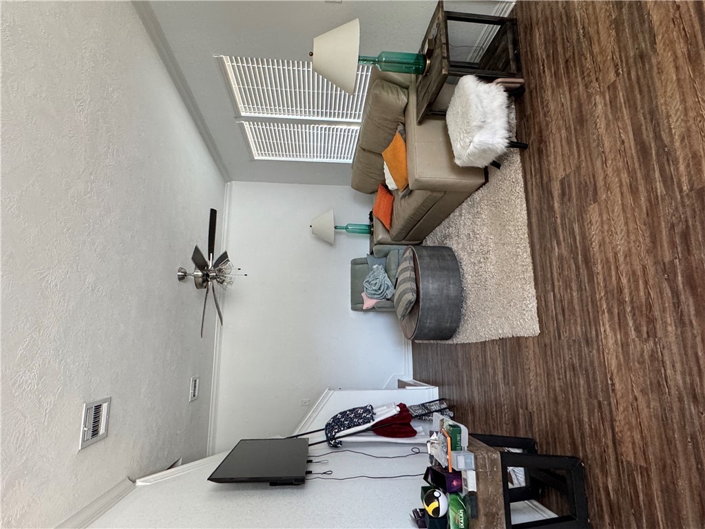 6991 Halter Loop College Station, TX 77845 - Photo 7 of 8 a living room with furniture and a flat screen tv