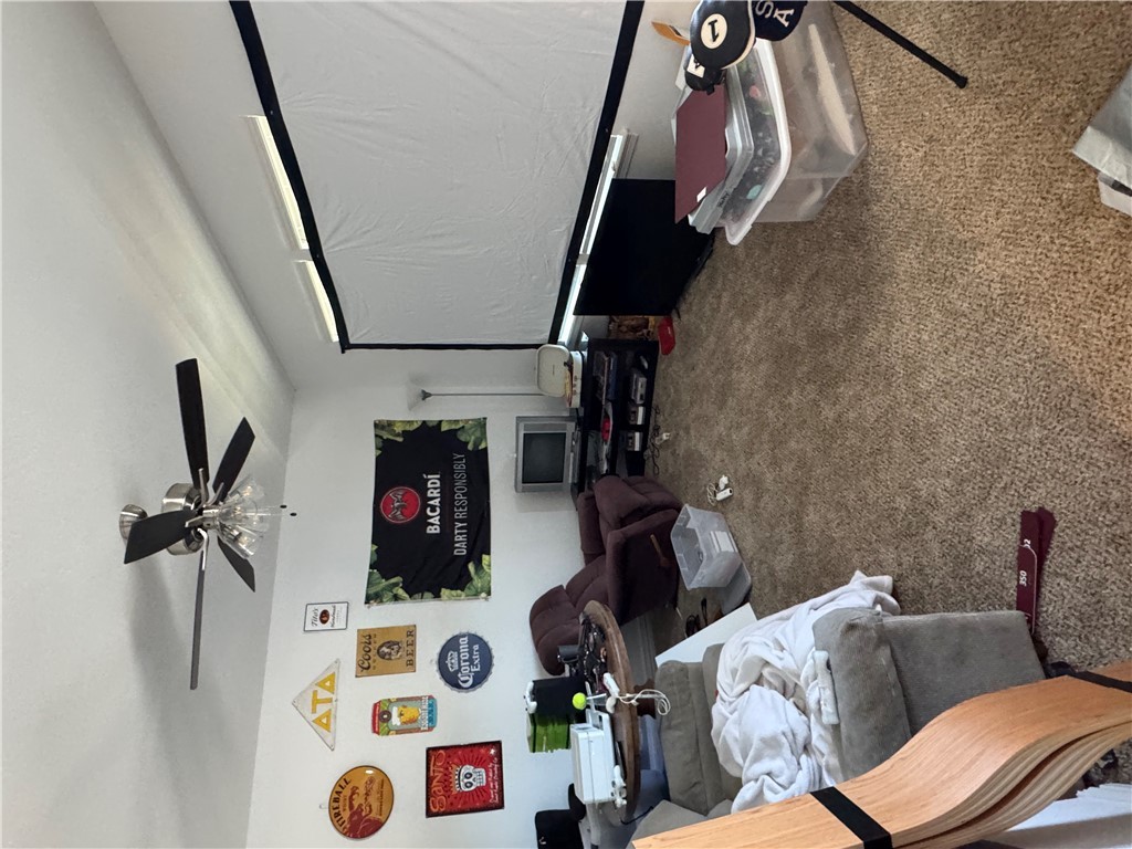 6991 Halter Loop College Station, TX 77845 - Photo 8 of 8 a living room with furniture and a flat screen tv