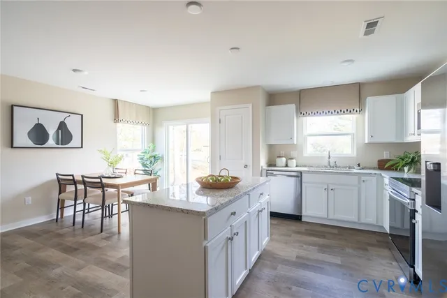 a kitchen with sink cabinets and window