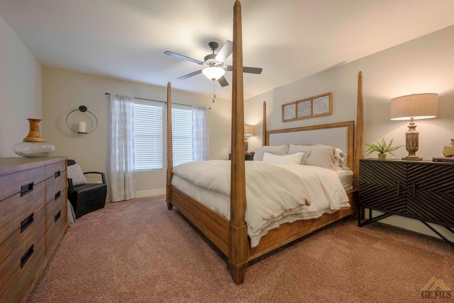 Undisclosed Address Bakersfield, CA 93311 - Photo 10 of 19 a bedroom with a bed and a lamp