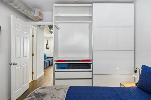 a room with a door and a rug