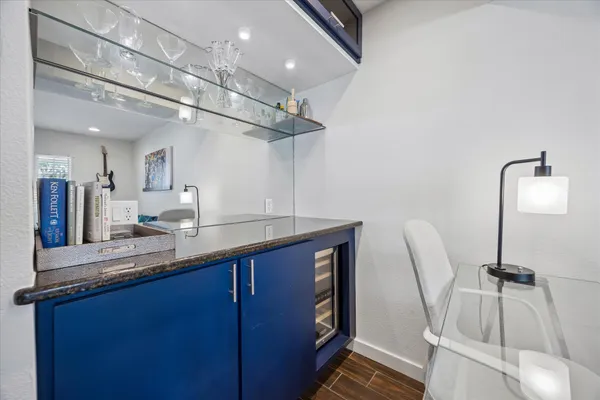 a kitchen with a sink cabinets and appliances