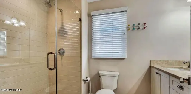 a bathroom with a shower and a sink