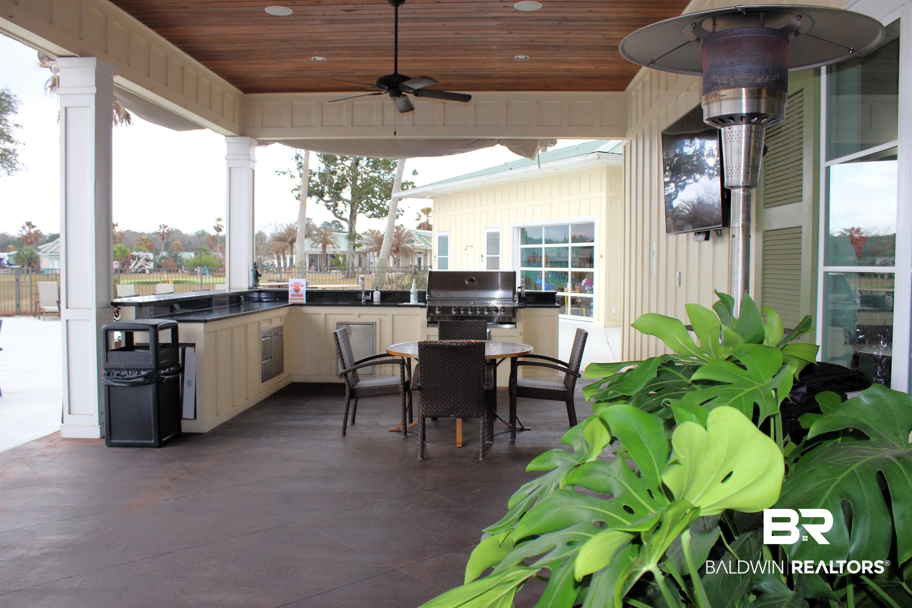 12277 Gateway Drive Elberta, AL 36530 - Photo 23 of 54 View of patio featuring outdoor dining area, a grill, ceiling fan, and an outdoor kitchen