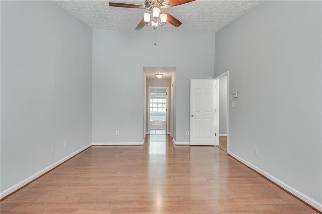 3337 Baymount Way Lawrenceville, GA 30043 - Photo 25 of 47 wooden floor in an empty room with a window