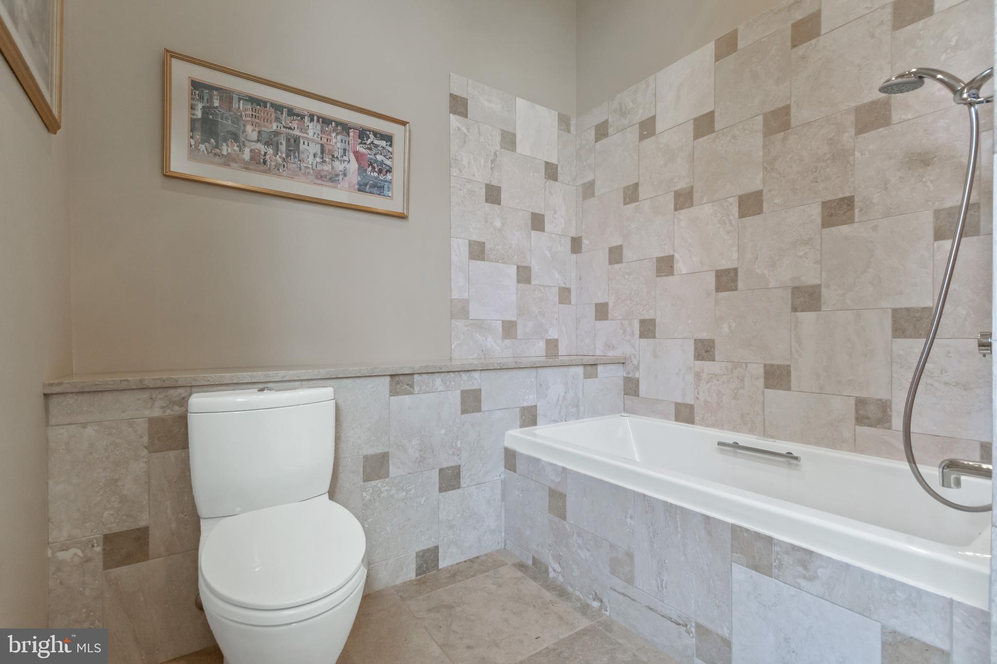 10107 Gary Road Potomac, MD 20854 - Photo 31 of 62 Main Level Guest Bathroom w/ Jerusalem Stone Floor