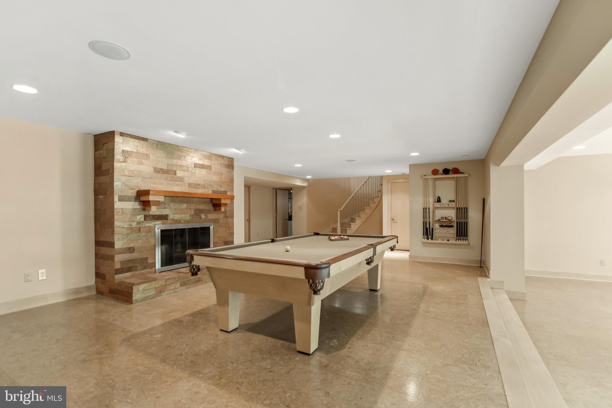 10107 Gary Road Potomac, MD 20854 - Photo 45 of 62 Lower Level Game Room with Stone Fireplace