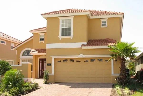 a front view of a house with a garage